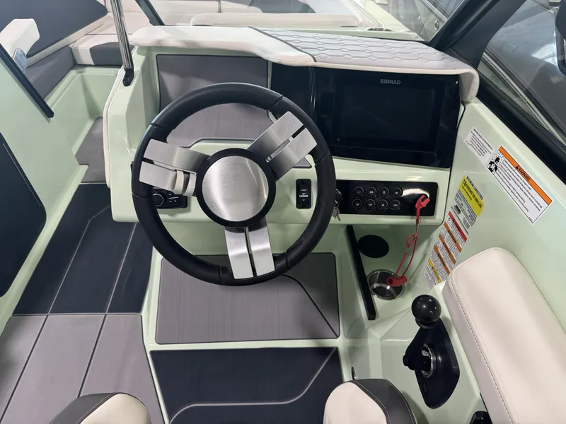 Slide: The Image of 2023 Heyday H22 boat helm with steering wheel and control panel. - 7