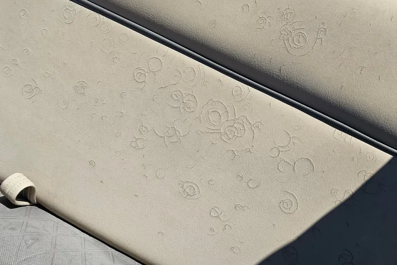 Slide: The Image of Close-up of 2023 Sun Tracker SportFish 22 XP3 seat with embossed patterns. - 14