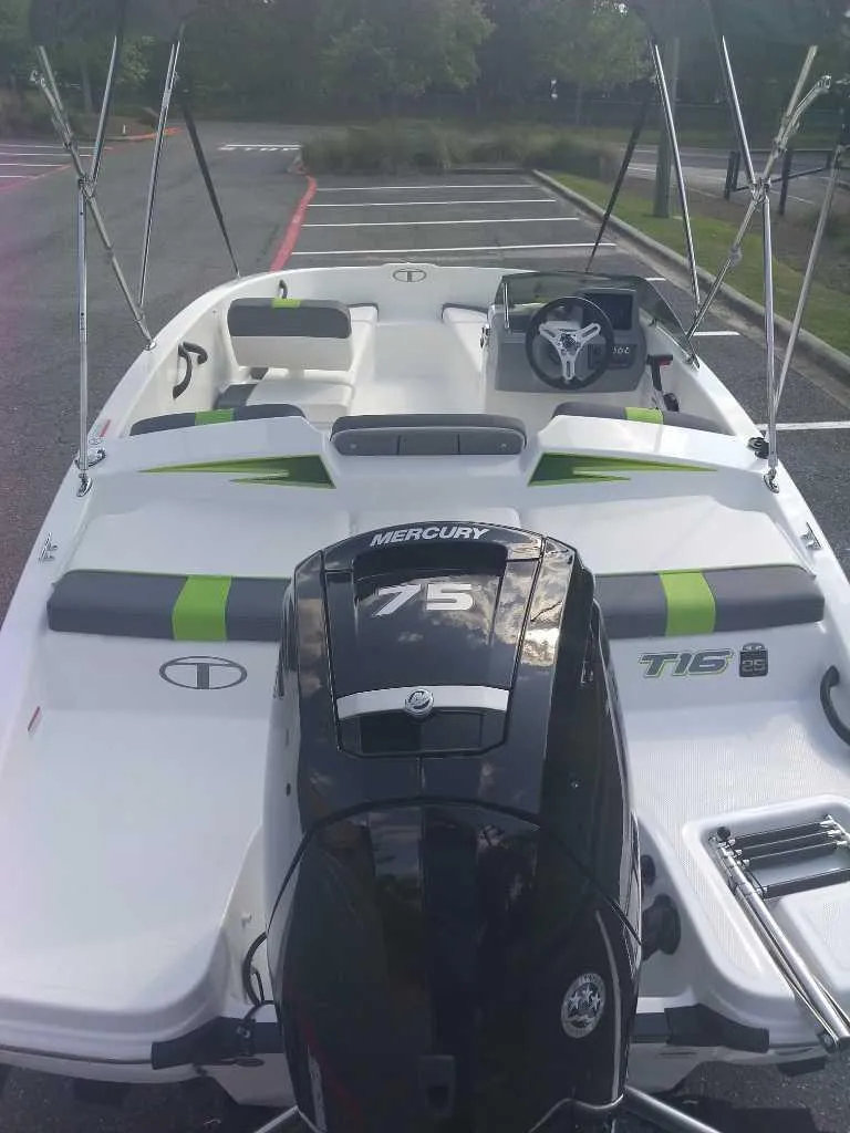 Slide: The Image of 2023 Tahoe T16 boat with Mercury 75 engine, rear view. - 4