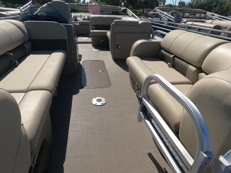 Slide: The Image of 2023 Sun Tracker SportFish 22 XP3 pontoon boat interior with beige seating. - 3