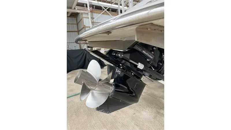 Slide: The Image of 2006 Cobalt 220 Bow boat propeller and stern drive in a storage facility. - 11