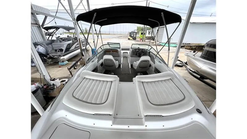 Slide: The Image of 2006 Cobalt 220 Bow boat with canopy, spacious seating, and sleek design. - 2