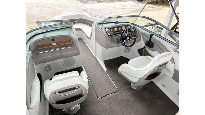 Slide: The Image of 2006 Cobalt 220 Bow boat interior with steering wheel and seating. - 3