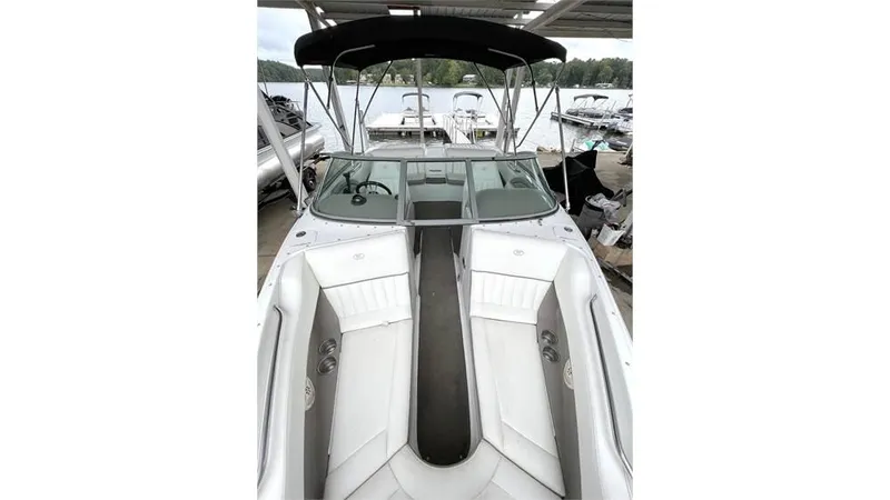 Slide: The Image of 2006 Cobalt 220 Bow boat with white interior and black canopy. - 5