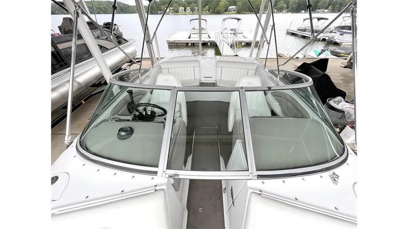 Slide: The Image of 2006 Cobalt 220 Bow boat docked at a marina. - 6