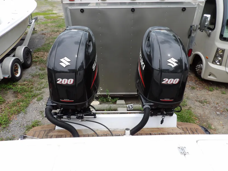 Slide: The Image of Twin Suzuki 200 outboard motors on a 1997 Hydra-Sports 2750 WA boat. - 14