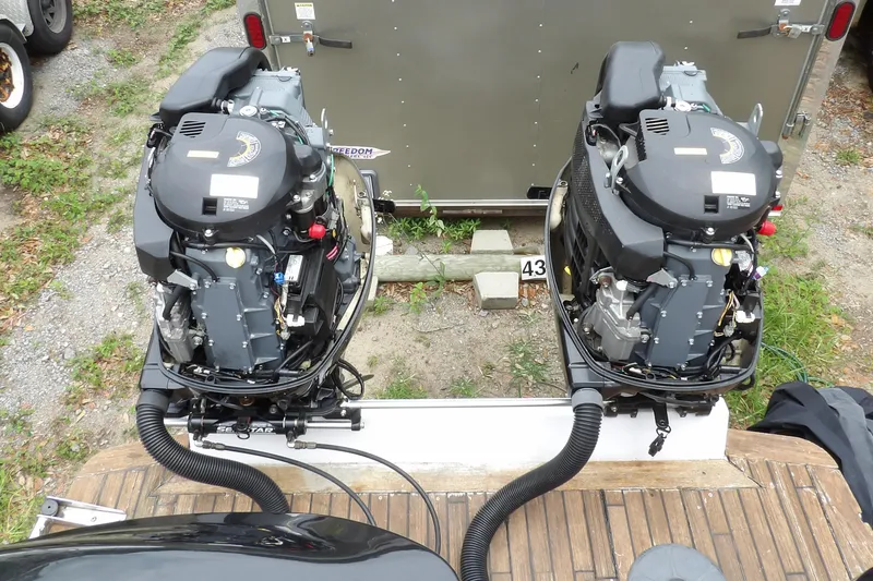 Slide: The Image of Twin outboard engines on a 1997 Hydra-Sports 2750 WA boat, viewed from above. - 15