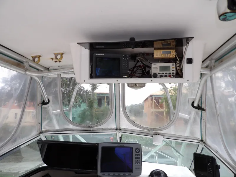 Slide: The Image of 1997 Hydra-Sports 2750 WA boat interior with navigation equipment and clear windows. - 27