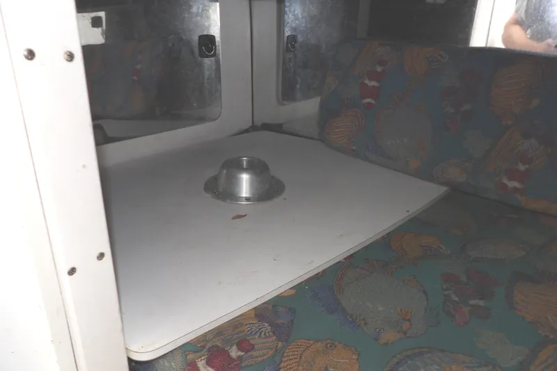 Slide: The Image of 1997 Hydra-Sports 2750 WA cabin interior with table and patterned seating. - 35
