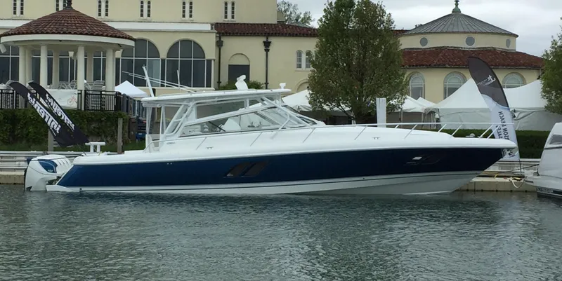The Image of 2017 Intrepid 475 Sport Yacht docked at a marina. - 0