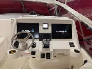 Slide: The Image of 2017 Intrepid 475 Sport Yacht helm with Garmin navigation displays. - 4