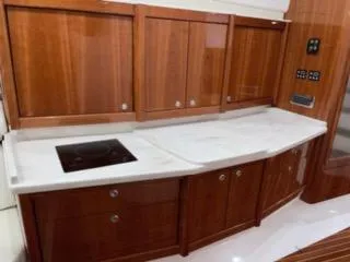 Slide: The Image of Luxurious wooden kitchen interior of 2017 Intrepid 475 Sport Yacht. - 9