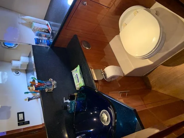 Slide: The Image of Bathroom interior of a 2015 Regal 42 Sport Coupe yacht. - 21