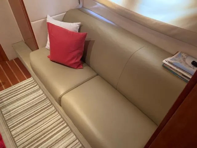 Slide: The Image of Luxurious interior seating of a 2015 Regal 42 Sport Coupe yacht with cushions. - 22