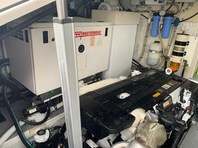 Slide: The Image of Engine room of a 2015 Regal 42 Sport Coupe with Westerbeke generator. - 33
