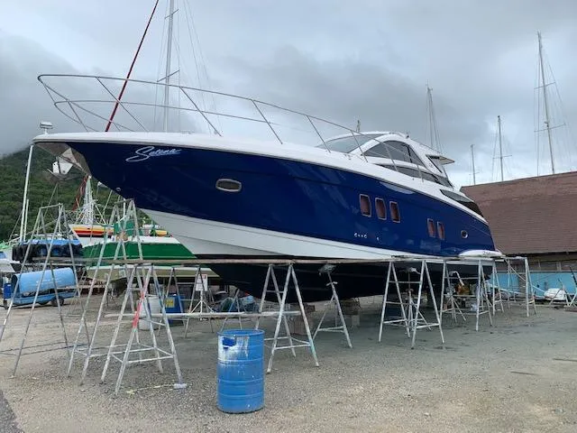 Slide: The Image of 2015 Regal 42 Sport Coupe yacht on stands in a boatyard. - 6