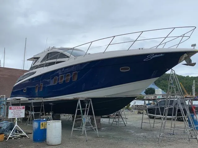 Slide: The Image of 2015 Regal 42 Sport Coupe yacht on dry dock for maintenance. - 8