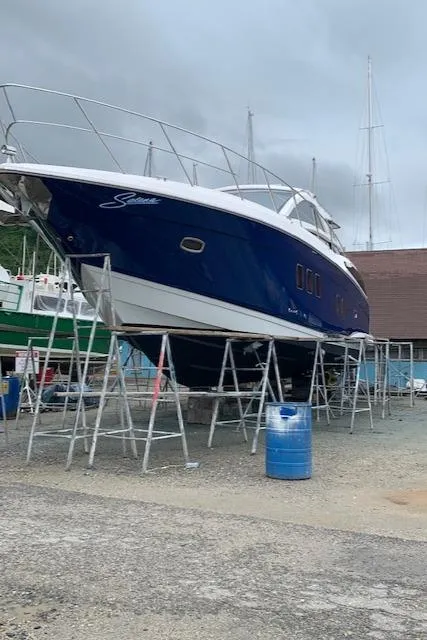 Slide: The Image of 2015 Regal 42 Sport Coupe yacht on dry dock for maintenance. - 9