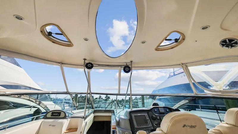 Slide: The Image of Interior view of 2007 Cruisers Yachts 520 Express helm station with panoramic windows. - 33