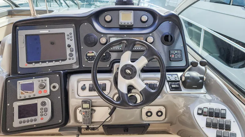 Slide: The Image of 2007 Cruisers Yachts 520 Express helm with navigation and control systems. - 35