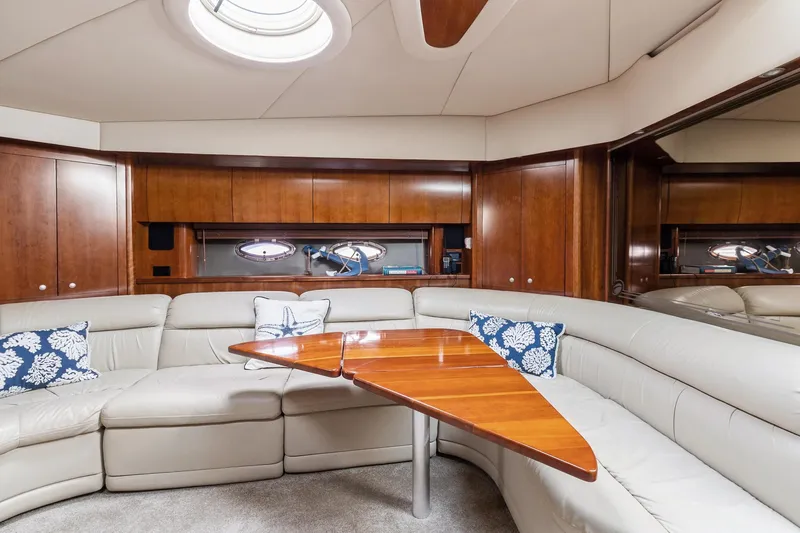 Slide: The Image of Luxurious interior of 2007 Cruisers Yachts 520 Express with leather seating and wooden table. - 7