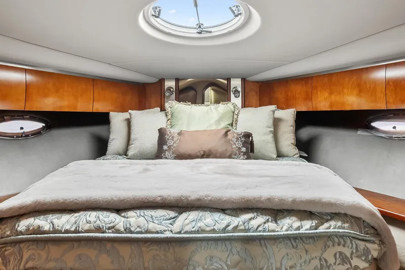 Slide: The Image of Luxurious bedroom in 2007 Cruisers Yachts 520 Express with skylight and plush bedding. - 14