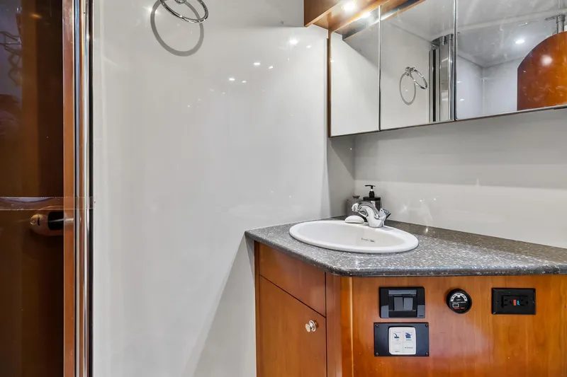 Slide: The Image of 2007 Cruisers Yachts 520 Express bathroom with sink and mirror. - 17