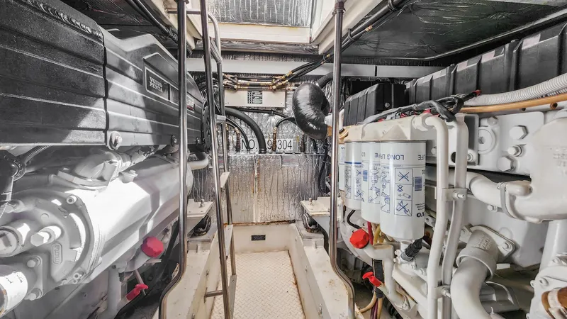 Slide: The Image of Engine room of a 2007 Cruisers Yachts 520 Express with visible machinery and components. - 21