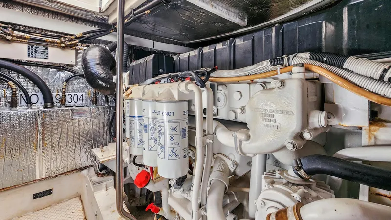 Slide: The Image of Engine room of a 2007 Cruisers Yachts 520 Express with detailed components. - 23