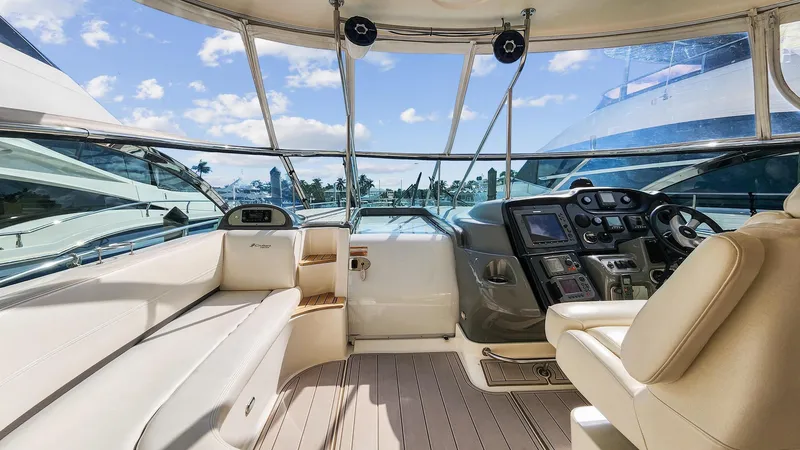 Slide: The Image of 2007 Cruisers Yachts 520 Express cockpit with luxurious seating and modern controls. - 32