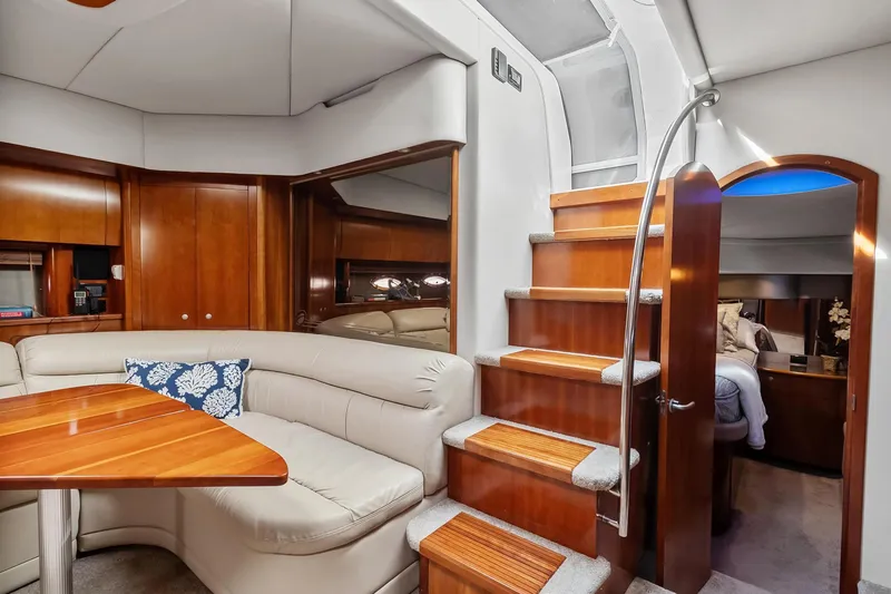 Slide: The Image of Luxurious interior of 2007 Cruisers Yachts 520 Express with wooden finishes and plush seating. - 6