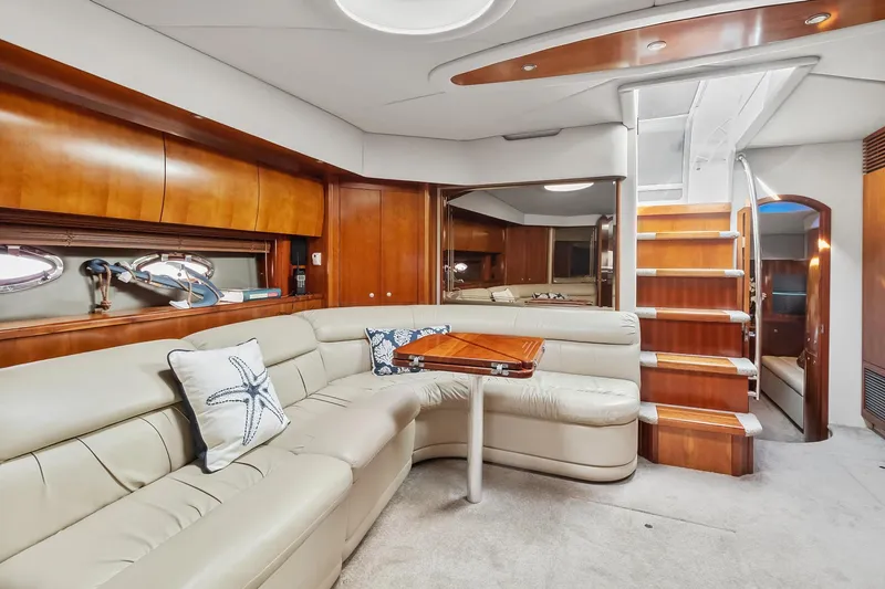 Slide: The Image of Luxurious interior of 2007 Cruisers Yachts 520 Express with leather seating and wooden accents. - 9