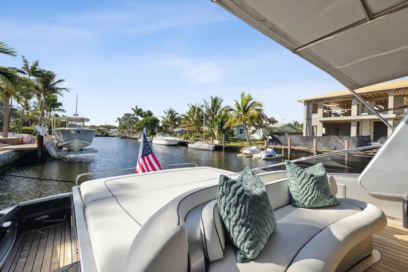 Slide: The Image of Luxury 2003 Baia Panther yacht docked in a scenic marina with palm trees. - 15