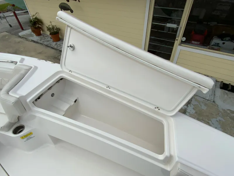 Slide: The Image of 2021 Blue Wave 2800 Makaira boat storage compartment with open lid. - 10
