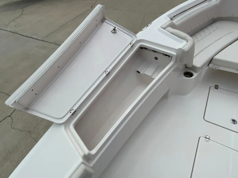 Slide: The Image of 2021 Blue Wave 2800 Makaira boat storage compartment and seating area. - 11