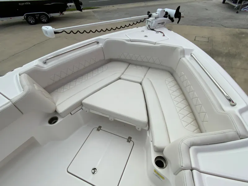 Slide: The Image of 2021 Blue Wave 2800 Makaira boat with white cushioned seating area. - 13