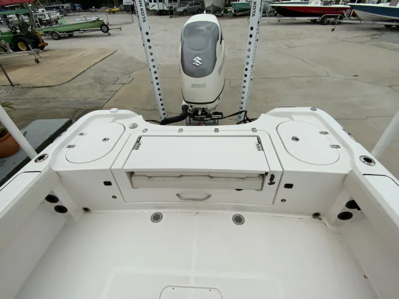 Slide: The Image of 2021 Blue Wave 2800 Makaira boat stern with Suzuki outboard motor. - 8