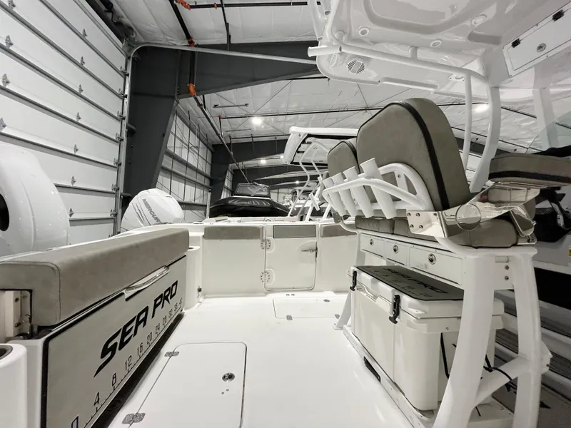Slide: The Image of 2024 Sea Pro 262CC boat interior in a storage facility. - 10