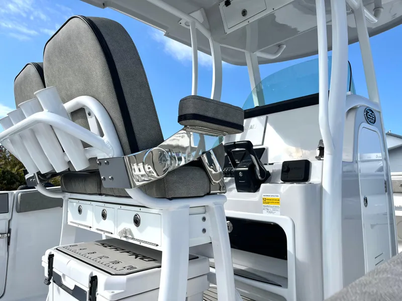 Slide: The Image of 2024 Sea Pro 262CC boat interior with helm seating and console. - 2