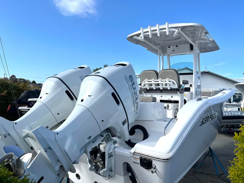 Slide: The Image of 2024 Sea Pro 262CC boat with dual engines, sleek design, and modern features. - 3