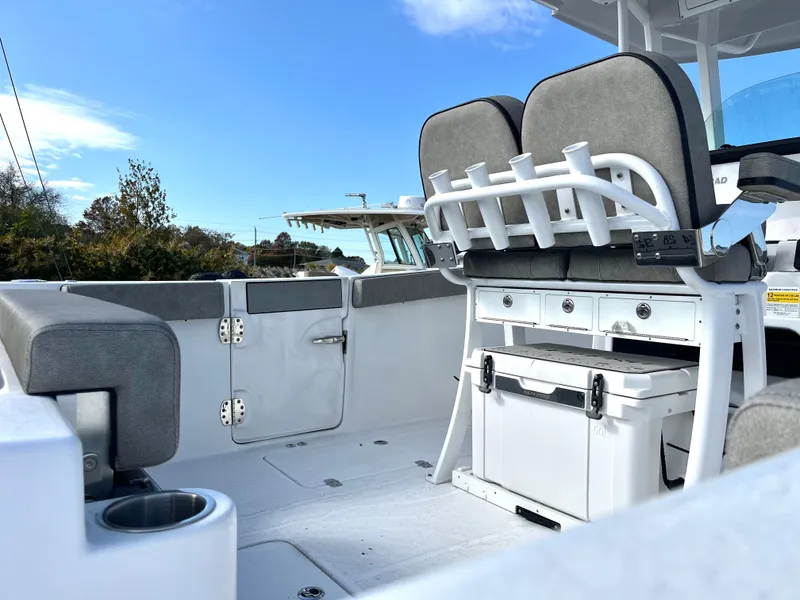 Slide: The Image of 2024 Sea Pro 262CC boat interior with seating and storage compartments. - 5