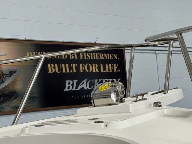 Slide: The Image of Parker 2500 Special Edition 2023 boat with stainless steel railings and spotlight. - 10