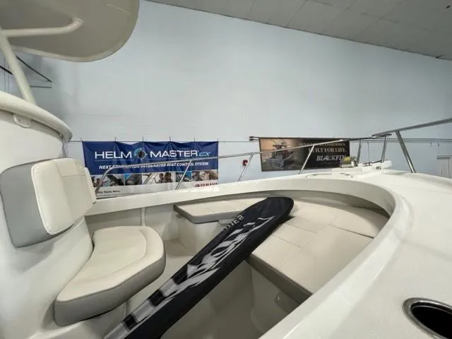 Slide: The Image of 2023 Parker 2500 Special Edition boat interior with seating and storage. - 11