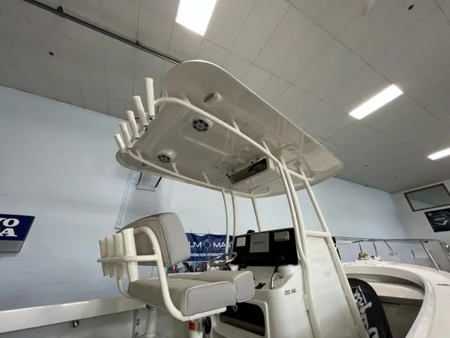 Slide: The Image of 2023 Parker 2500 Special Edition boat interior with T-top and seating. - 12