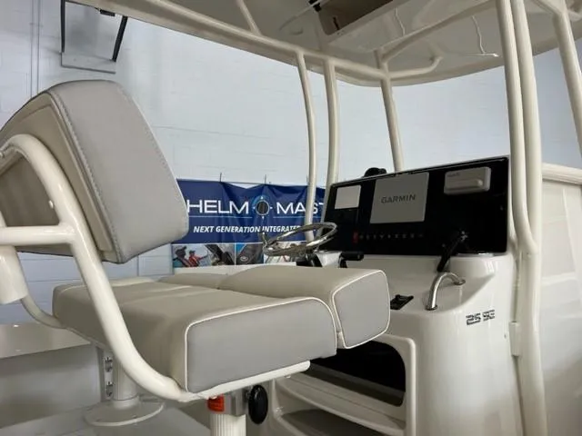 Slide: The Image of Parker 2500 Special Edition 2023 boat interior with helm and seating. - 13