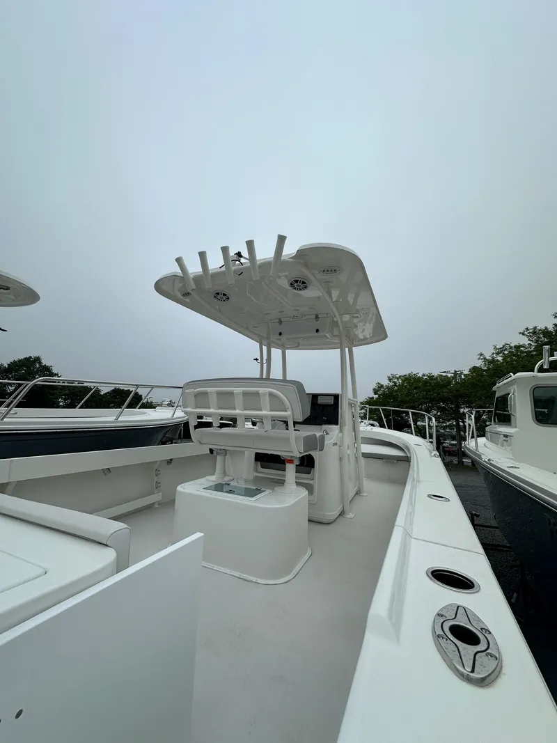 Slide: The Image of 2023 Parker 2500 Special Edition boat with center console and T-top. - 5