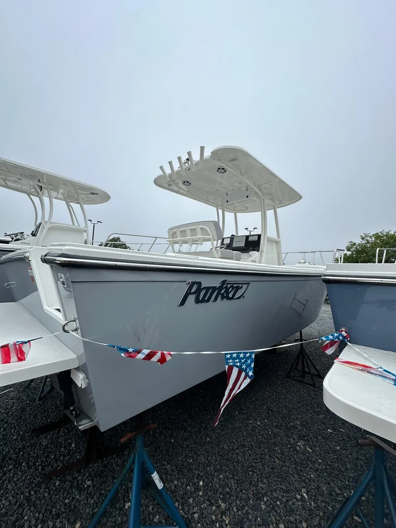 Slide: The Image of 2023 Parker 2500 Special Edition boat on display with American flags. - 6