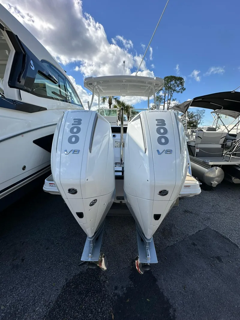 Slide: The Image of 2024 Blackfin 272 DC with twin 300 V8 engines docked at marina. - 3