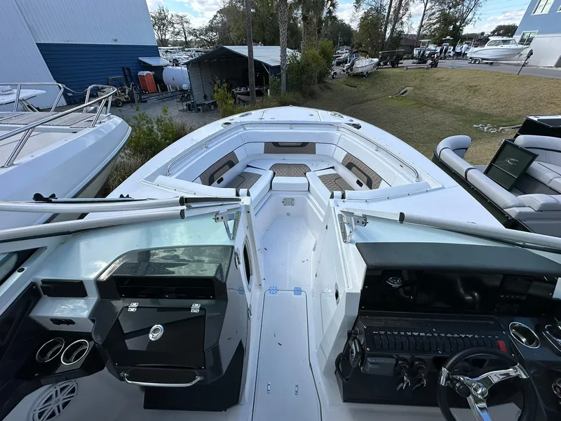 Slide: The Image of 2024 Blackfin 272 DC boat interior with dual consoles and spacious seating. - 4