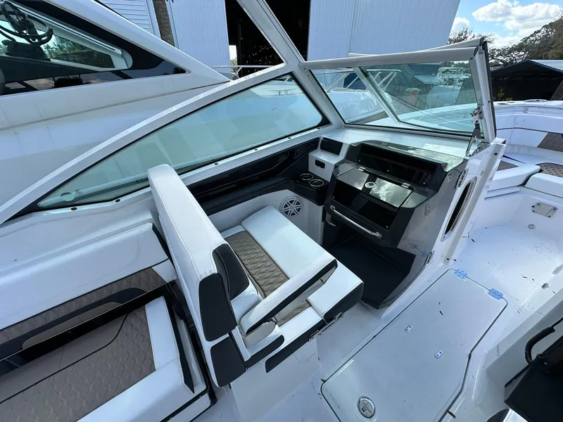 Slide: The Image of 2024 Blackfin 272 DC boat interior with helm station and seating. - 5